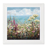 A square print of a painting featuring a cluster of wild flowers in front of a body of water