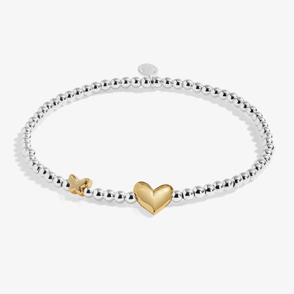 Silver beaded birth month bracelet for April with gold heart and butterfly charms