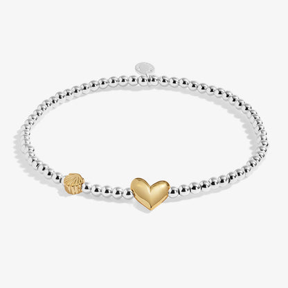 Silver beaded birth month bracelet for August with gold heart and seashell charms