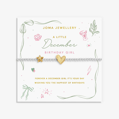 Silver beaded bracelet with a gold heart and star charm for a December birthday on a sentiment card