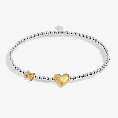 Silver beaded birth month bracelet for January with gold heart and bow charms
