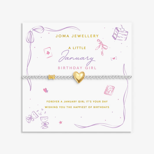 Joma silver beaded birth month bracelet for January with gold heart and bow charms on a sentiment card