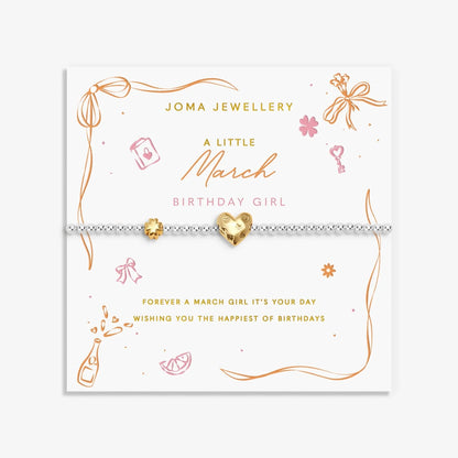 Joma silver beaded birth month bracelet for March with gold heart and clover charms on a sentiment card