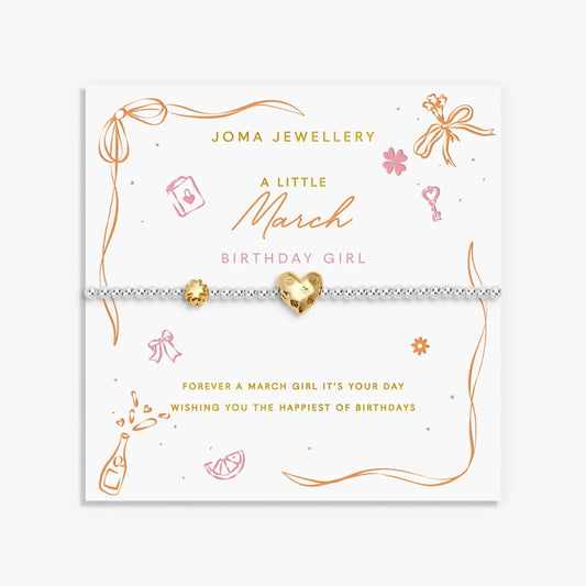 Joma silver beaded birth month bracelet for March with gold heart and clover charms on a sentiment card