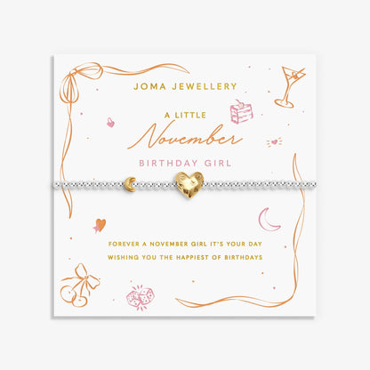 Joma silver beaded birth month bracelet for November with gold heart and moon charms on a sentiment card