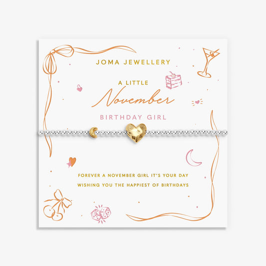 Joma silver beaded birth month bracelet for November with gold heart and moon charms on a sentiment card