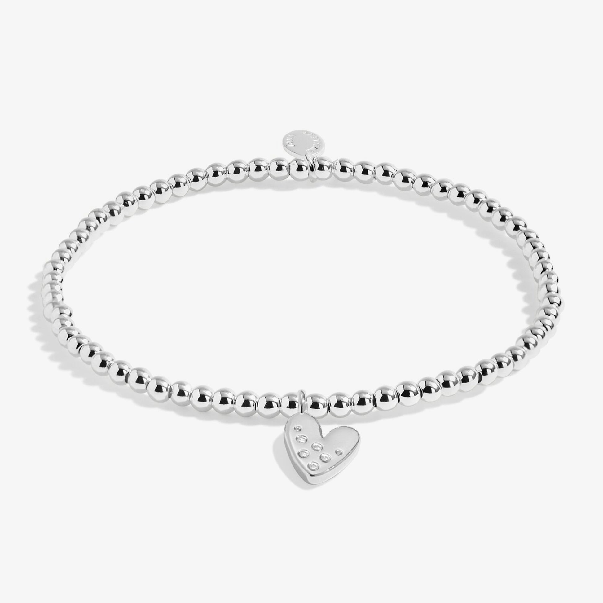 Silver stretch beaded bracelet with a heart charm set with a constellation of CZ stones