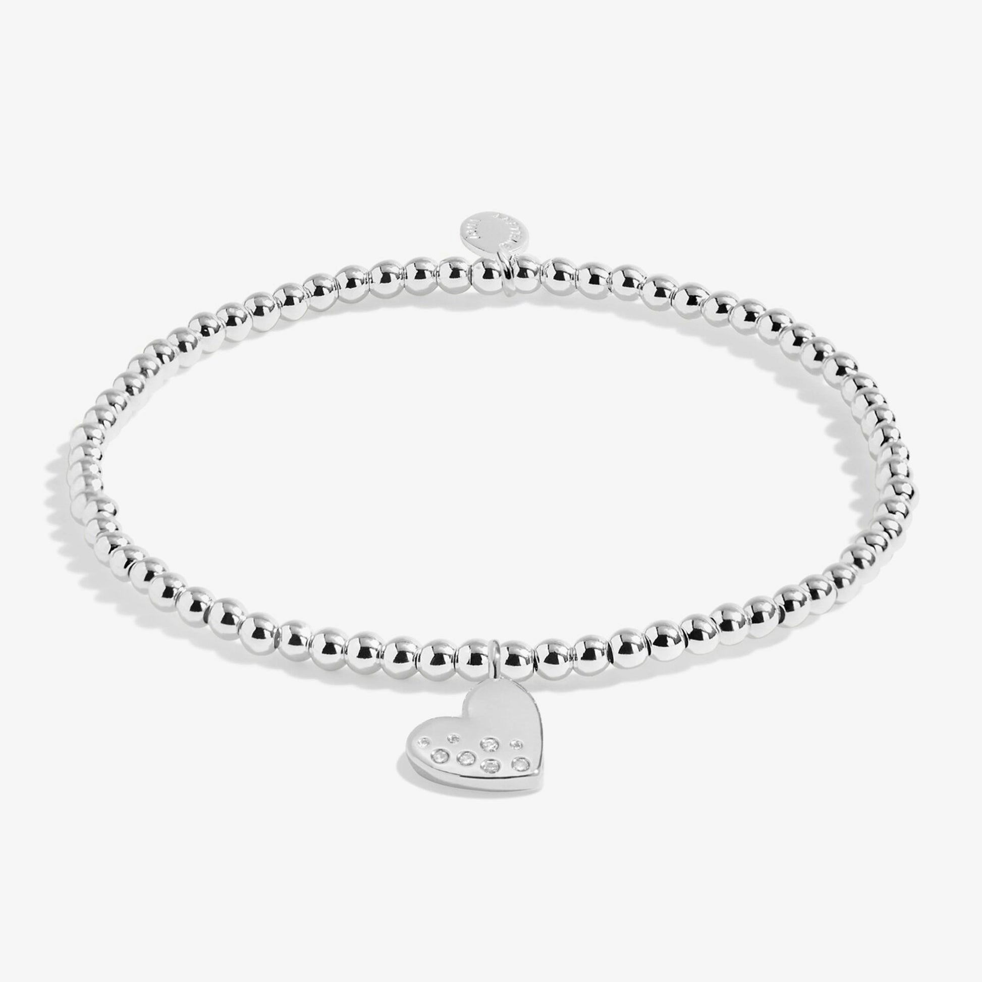 Silver stretch beaded bracelet with heart shaped charm set with a constellation of CZ stones