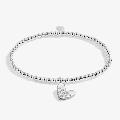 Silver stretch bracelet with a heart charm set with a constellation of CZ stones