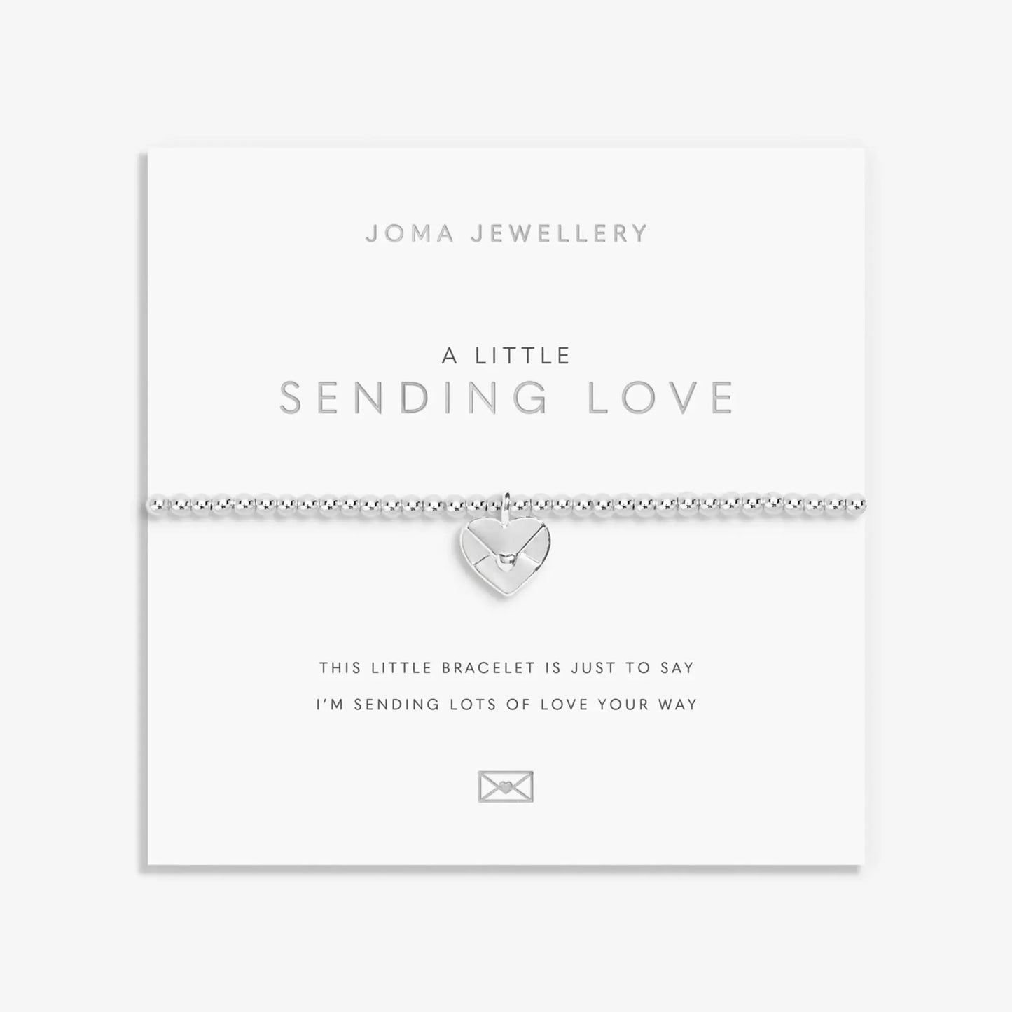 Silver beaded bracelet with heart shaped envelope charm on sentiment card