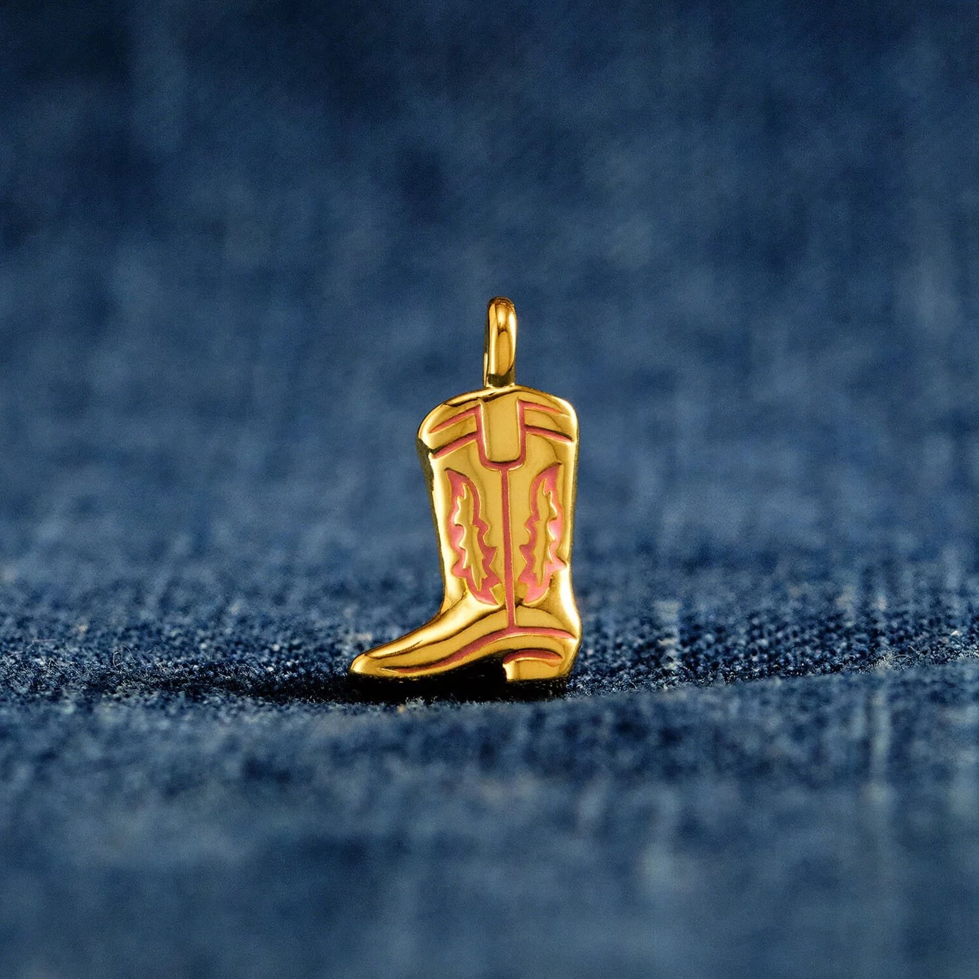Gold cowboy boot charm with pink enamel details
