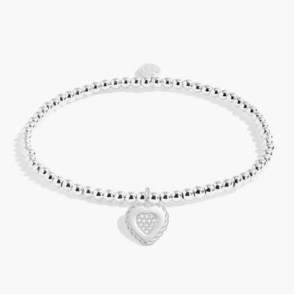 Silver beaded bracelet with twist frame heart charm inset with CZ stones