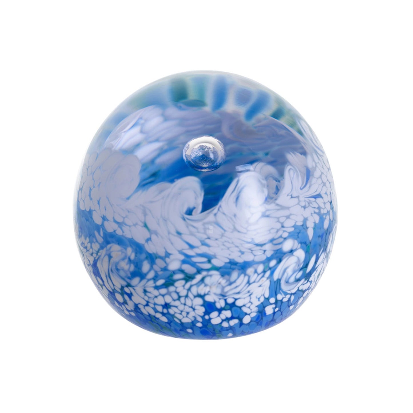 A glass paperweight with blues and white foaming ocean wave shapes