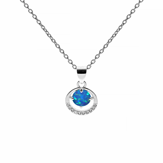 Round silver pendant with a ring of CZ stones and a bright blue synthetic opal in the centre