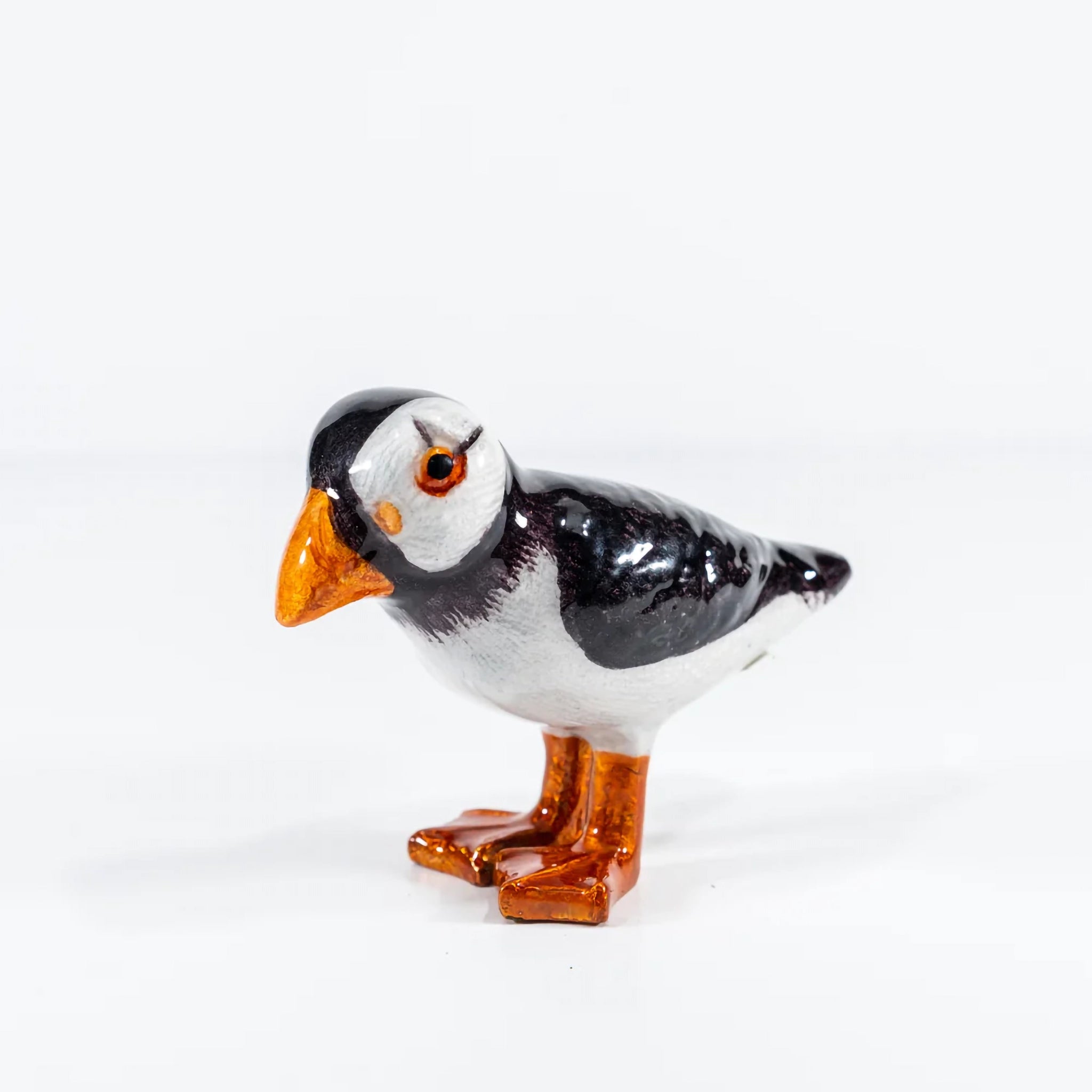 Small black, white and orange shiny enamel puffin ornament