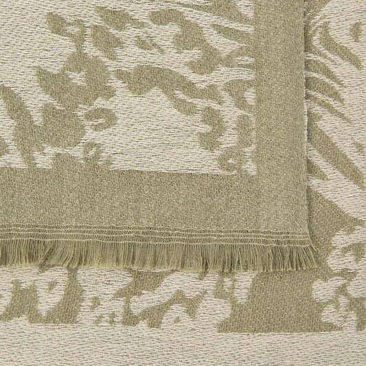 Detailed zoom of a scarf in khaki with mixed animal print design and small fringe