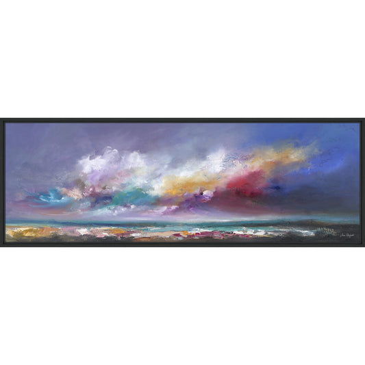 A framed print of multicoloured clouds and sea