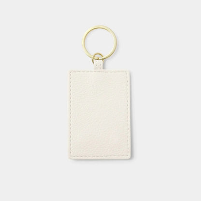 White faux leather keyring back