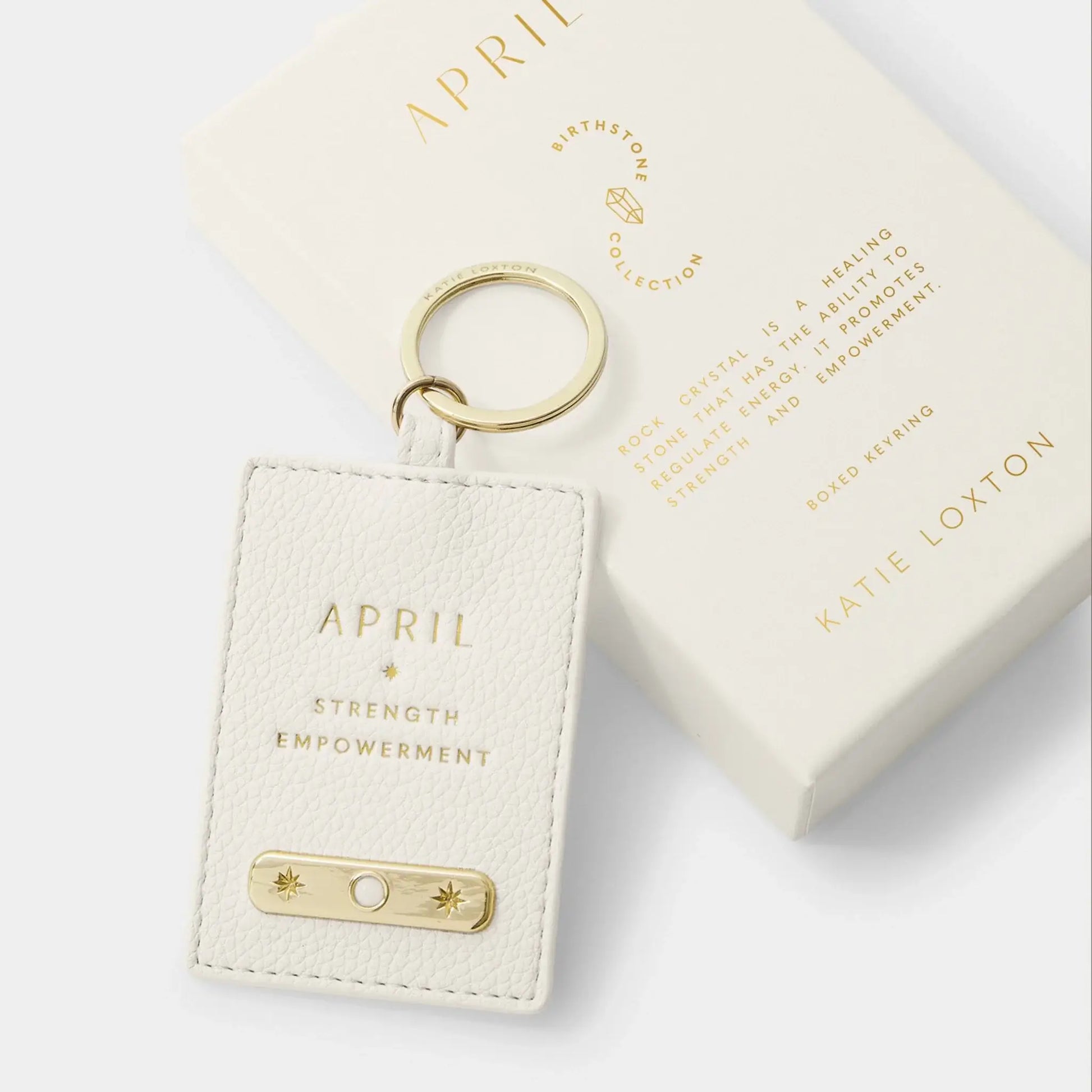 White faux leather keyring with a semi-precious rock crystal for April