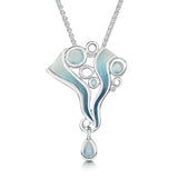 Silver pendant on chain with blue enamel shapes like water and round open silver circles to represent ice.