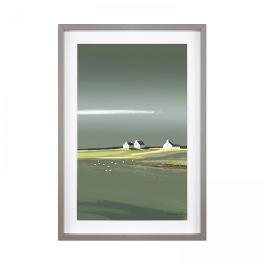 Framed print of a coastal scene in greens and blues with three white cottages on the horizon.
