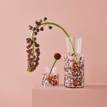 Two glass vases with brown and white pebble details lifestyle