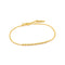 A gold chain bracelet featuring a bar of linked small balls and an adjustable circle clasp closure