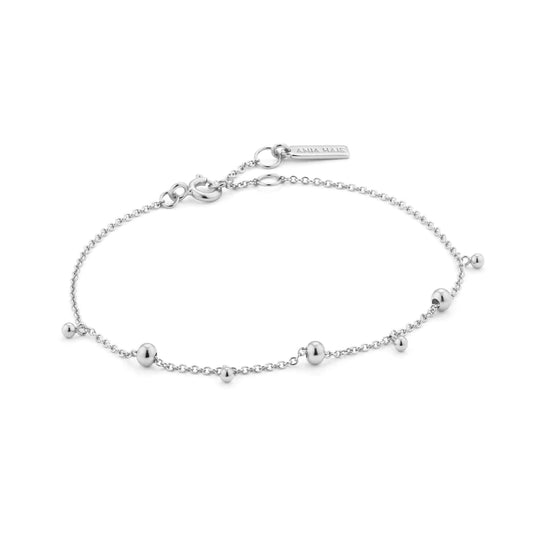 A silver chain bracelet with alternating linked balls and drop balls and an adjustable round clasp closure