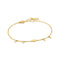 Gold chain bracelet featuring four small disc shaped drops, one larger drop link and an adjustable round clasp closure