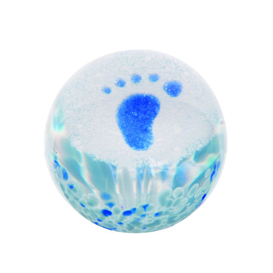 Round glass paperweight with blue baby footprint and blue confetti details