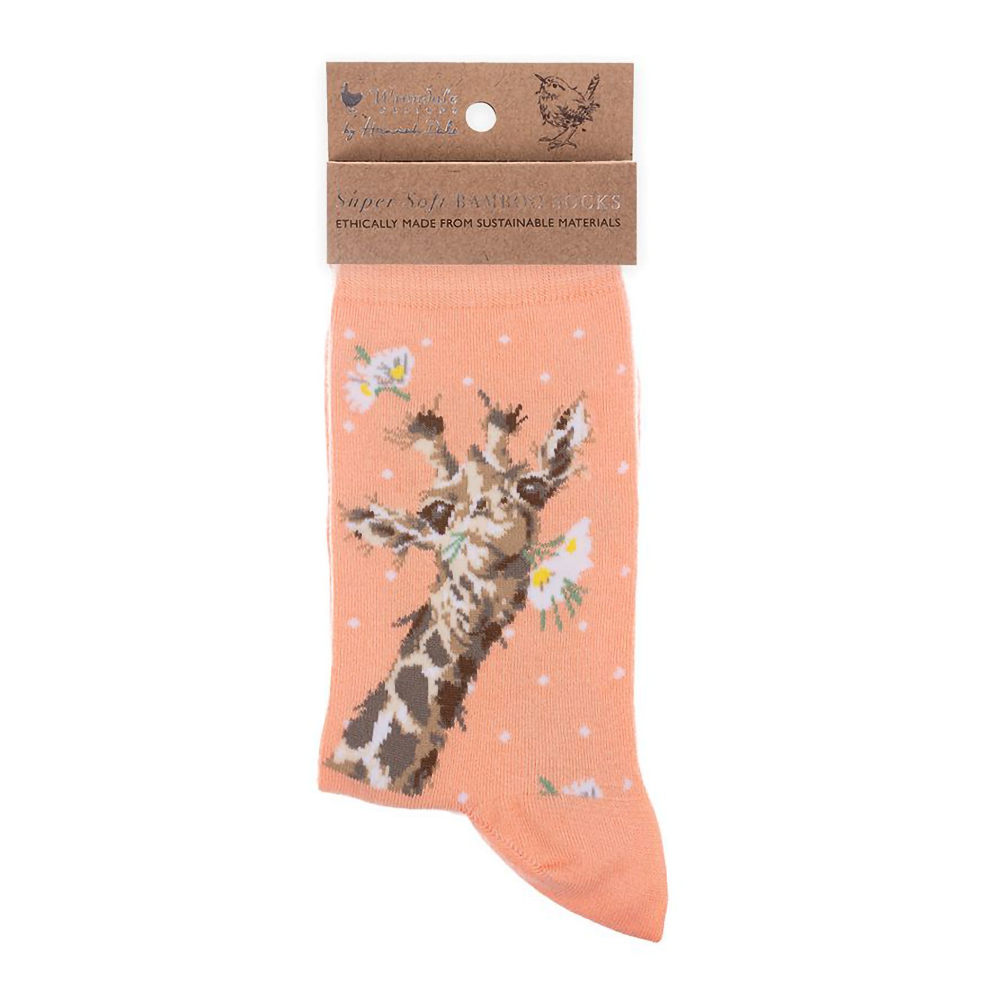Folded pair of coral pink socks with a giraffe and daisies picture and white polka dots