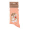 Folded pair of pink socks with a hamster and jam filled biscuits picture and white polka dots