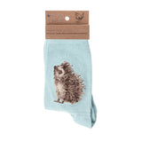 Folded pair of mint green socks with a hedgehog picture and white stripes