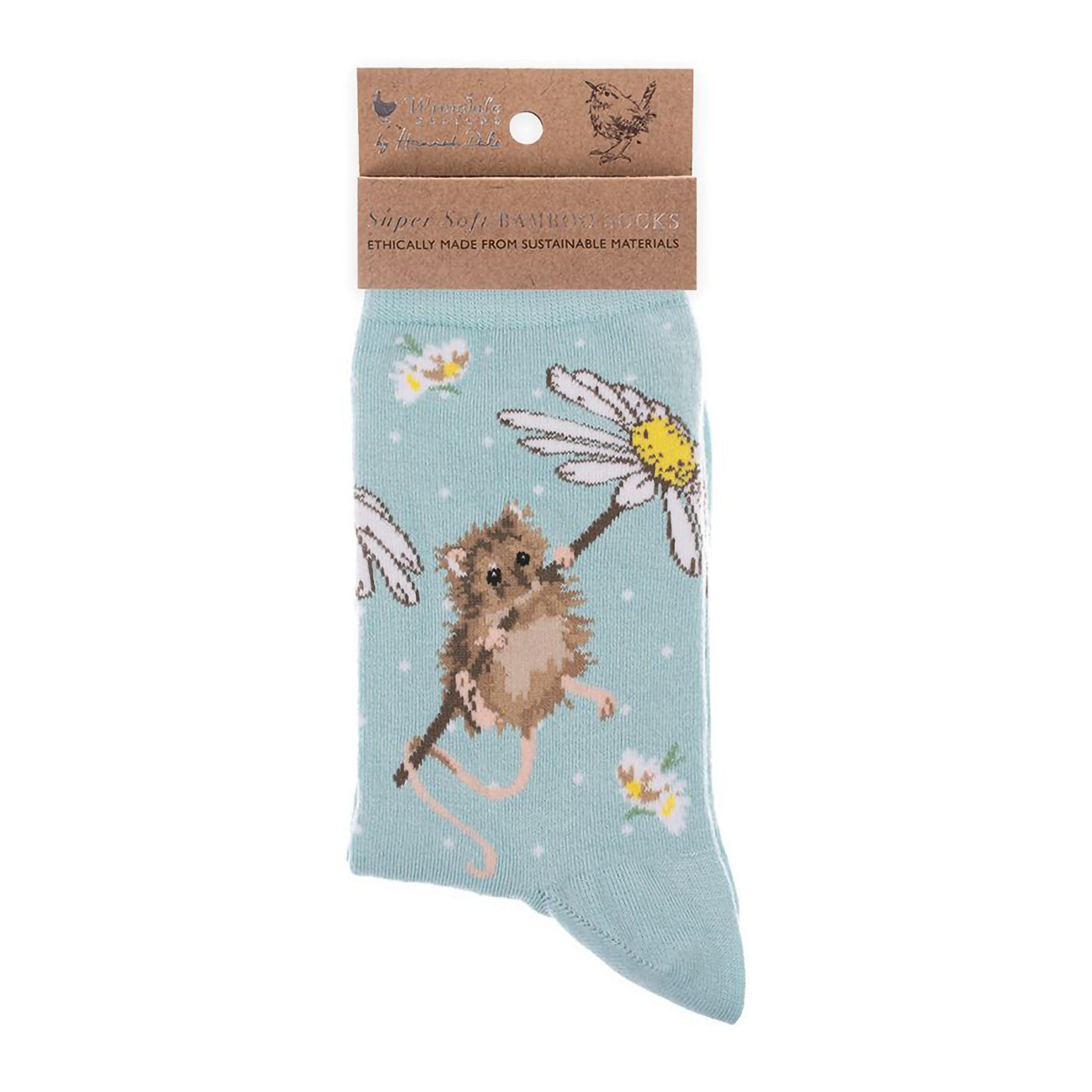 Folded pair of light blue socks with a mouse holding a daisy picture and white polka dots
