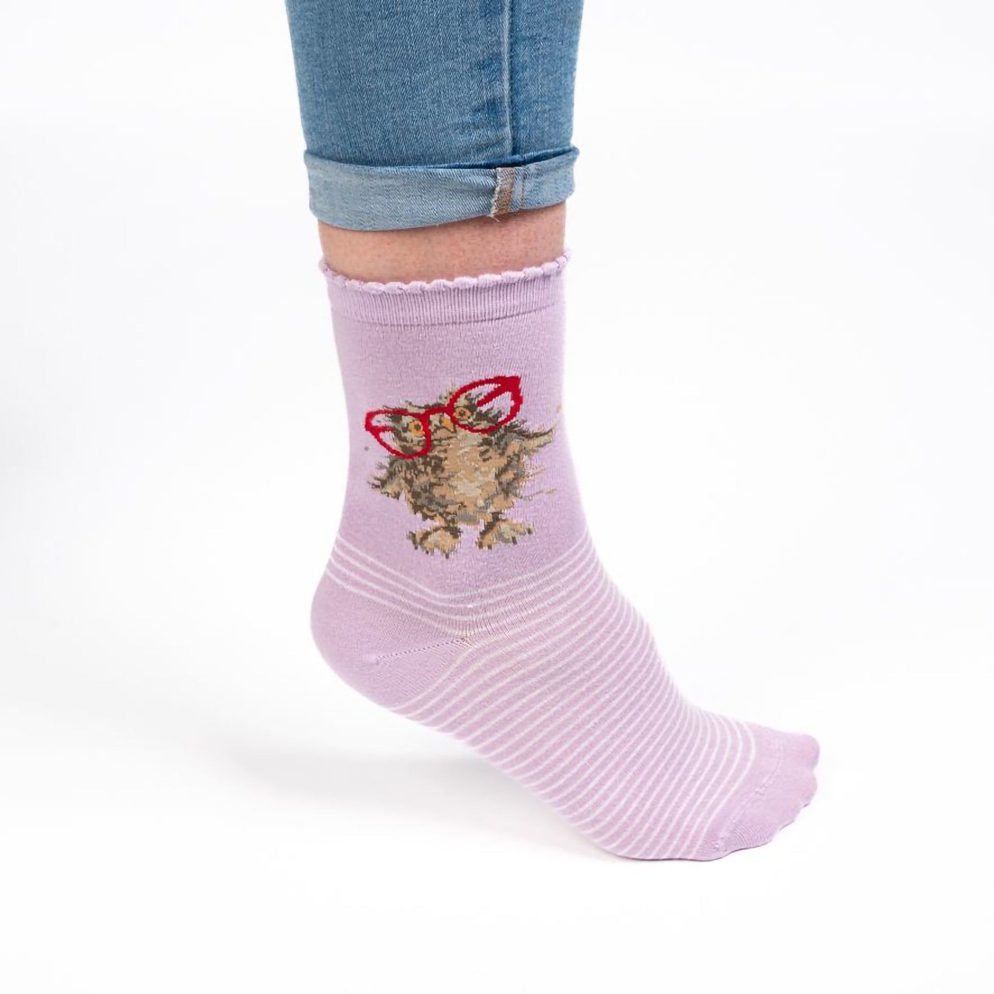 Model wearing a pair of lilac purple socks with a owl with red glasses picture and white stripes