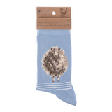 Folded pair of light blue socks with a fluffy sheep picture and white stripes