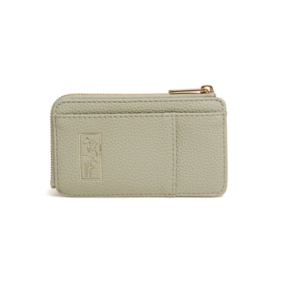 Pistachio green faux leather purse with embossed gold logo and zip closure