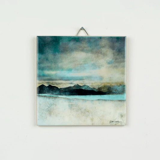 A ceramic tile featuring a landscape painting by Cath Waters