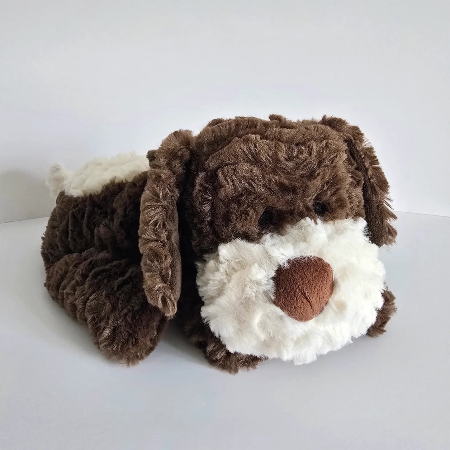 Plush brown dog toy with microwavable flax-seed head bag insert