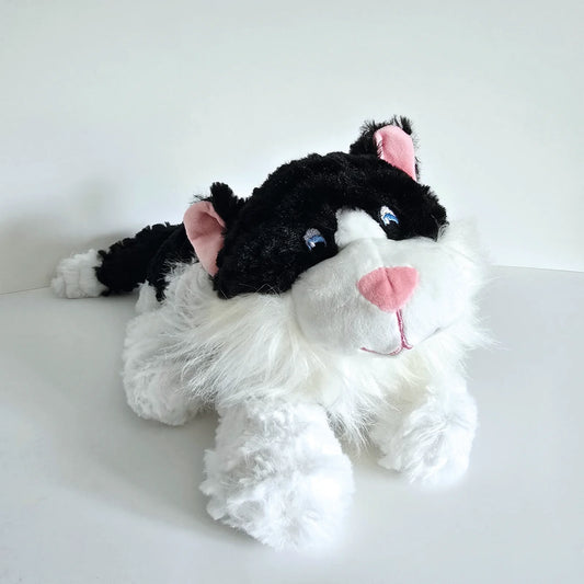 Plush black and white cat toy with microwavable flax-seed head bag insert