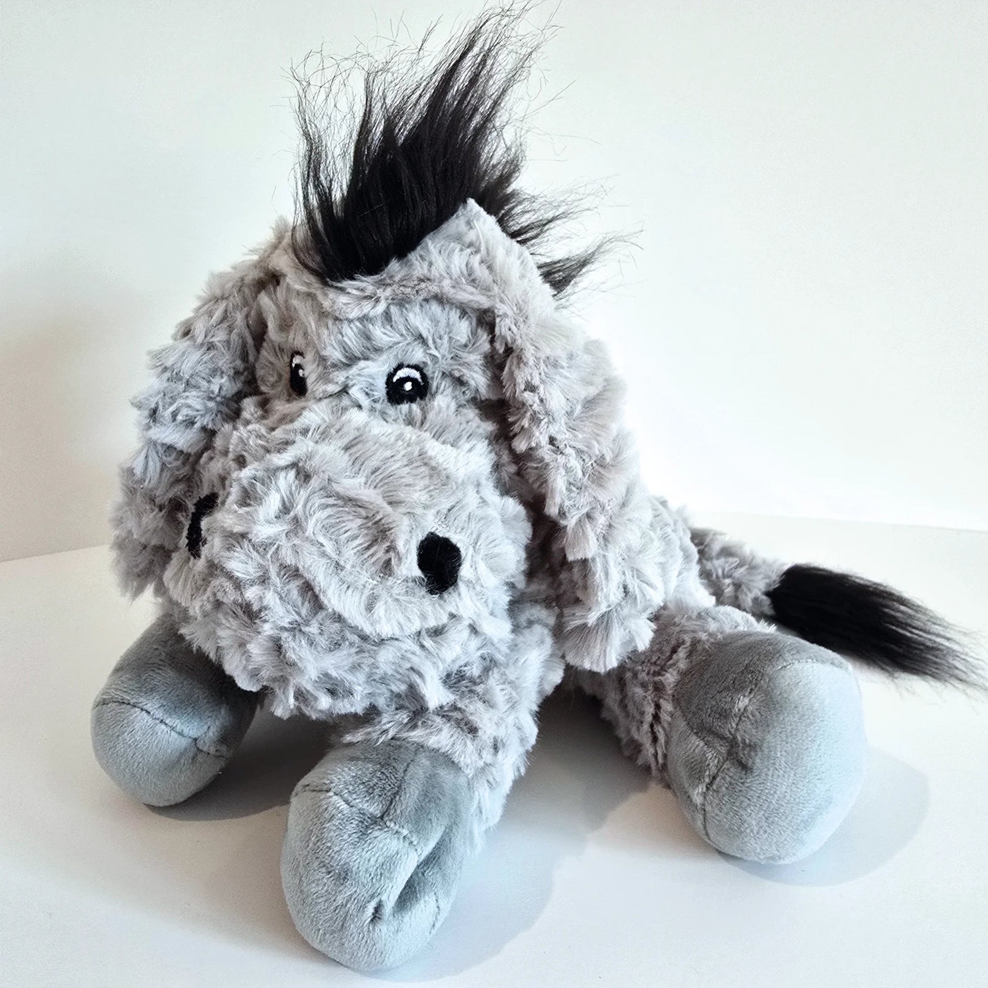 Plush donkey toy in grey with microwavable flax-seed head bag insert