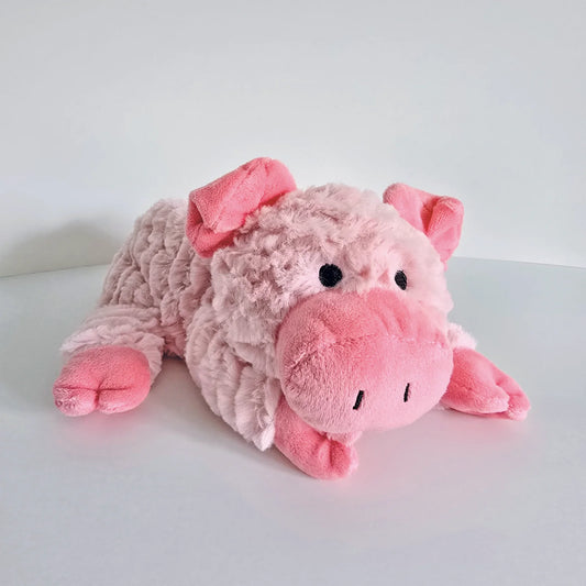 Plush pink pig toy with microwavable flax-seed head bag insert