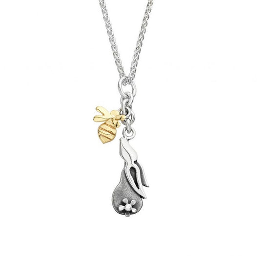 A silver chain with two drop pendants, on silver bunny with flower tail and one yellow gold bee
