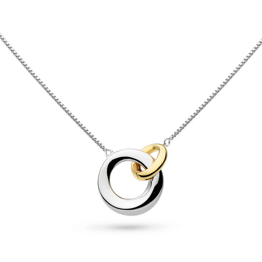 A necklace with linked silver and gold rings with bevel shape