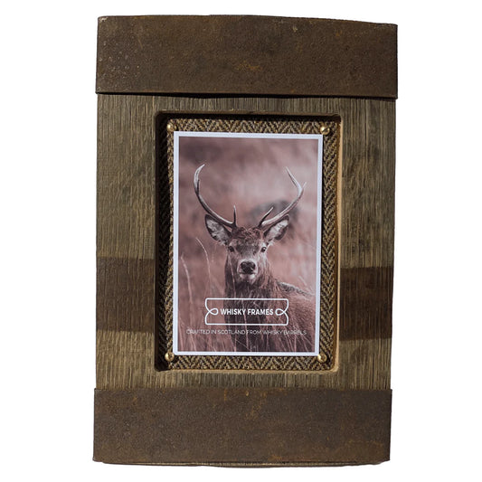 A vertical photo frame with barrel hoop details and Harris Tweed