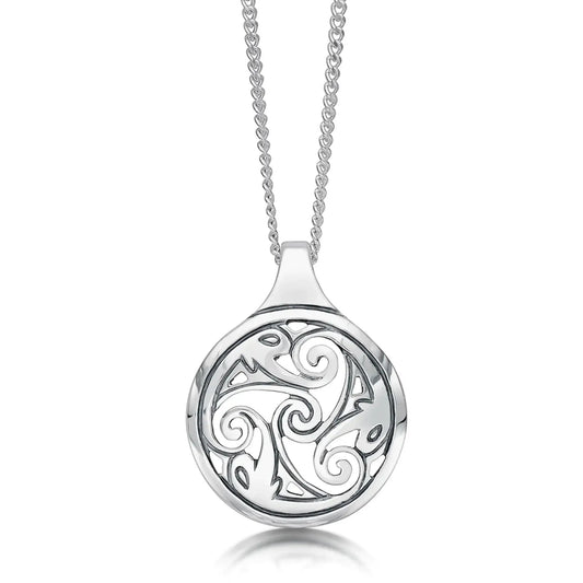 Round silver pendant with engraved triskele swirl in the centre and ornate pictish shapes