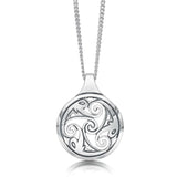 Round silver pendant with engraved triskele swirl in the centre and ornate pictish shapes