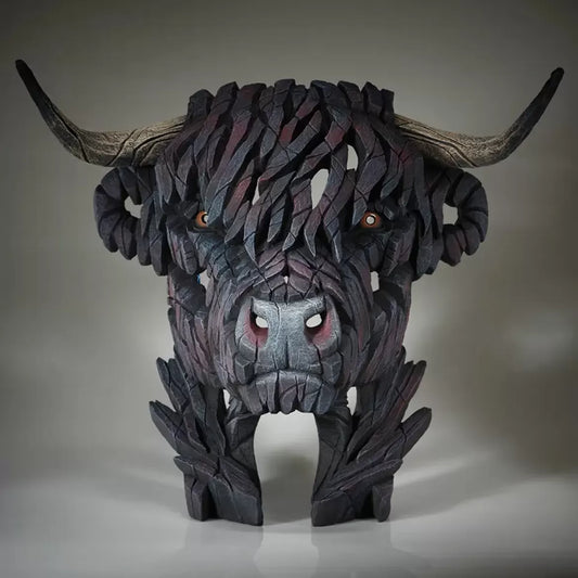 A textured and painted black Highland cow head bust sculpture