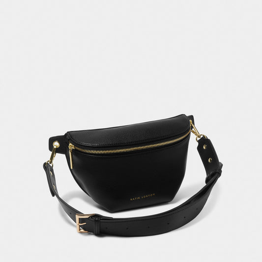 A belt bag in faux leather and black with gold hardware