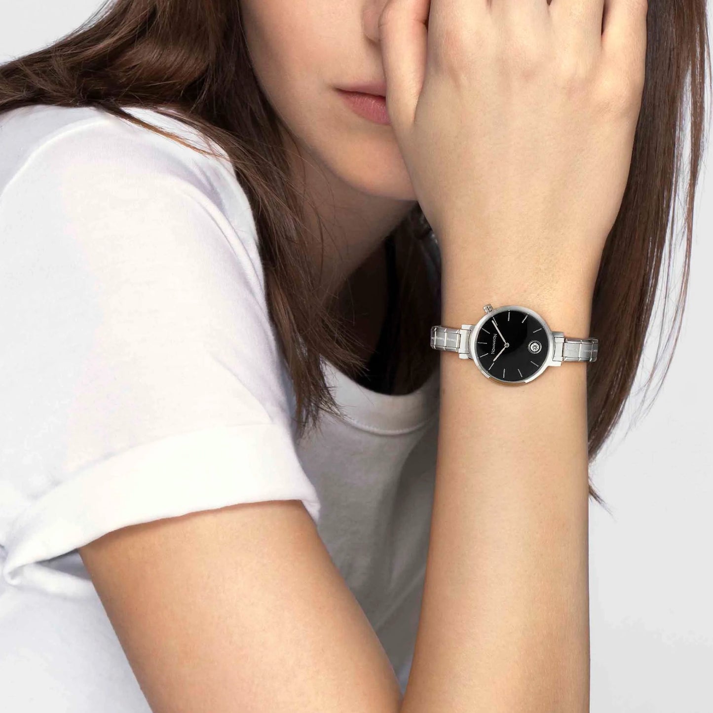 Model wearing Nomination Italy round stainless steel watch with CZ and black face